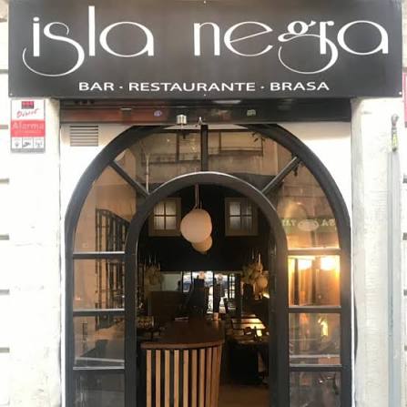 Isla Negra’s black sign and arched glass entrance at Sepúlveda, 159